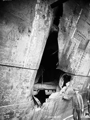 HMS HAWKE collision damage-middle hole looking forward, with figure..jpg